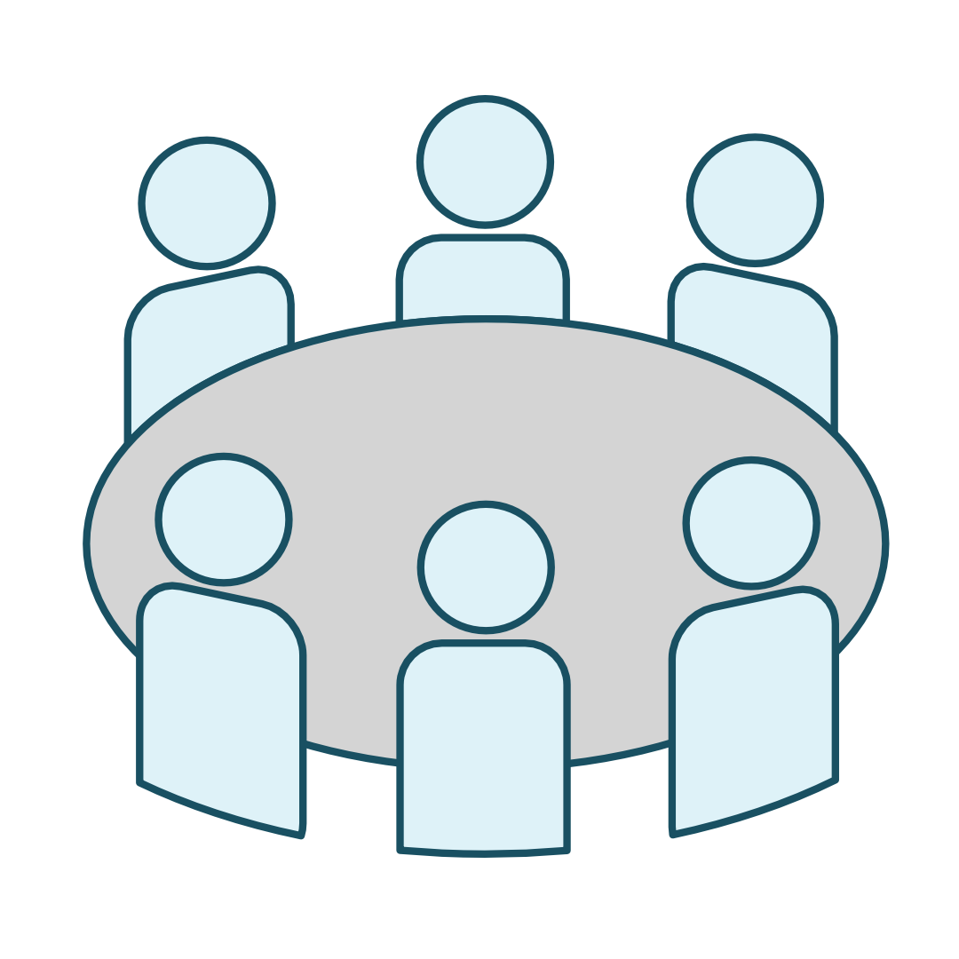 A table with people sitting around it.
